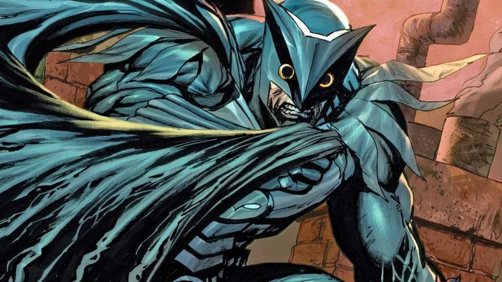 Owlman en armure bleu-vert, masque de hibou et cape, dans les comics
